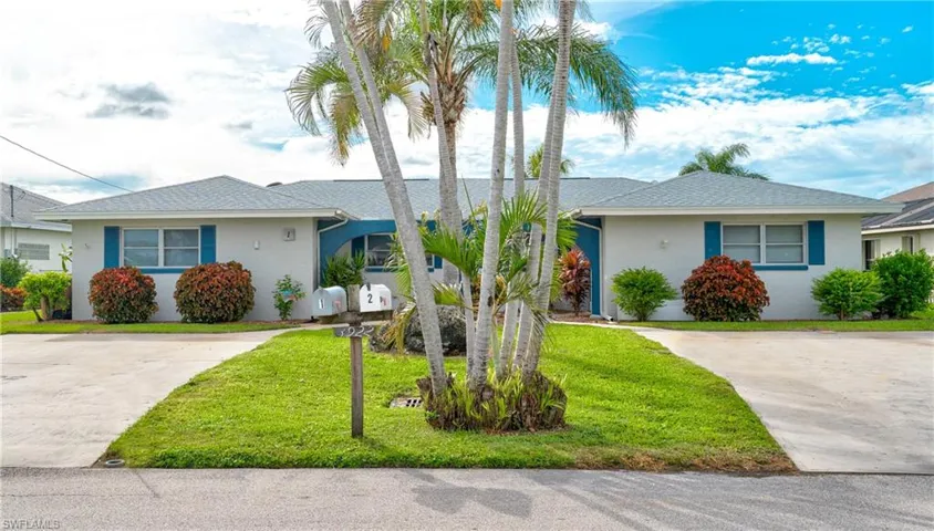 Single story home with a front lawn