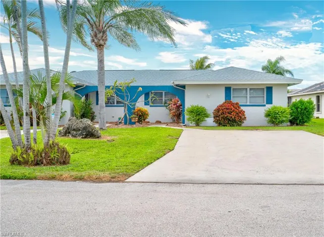 Ranch-style home with a front yard