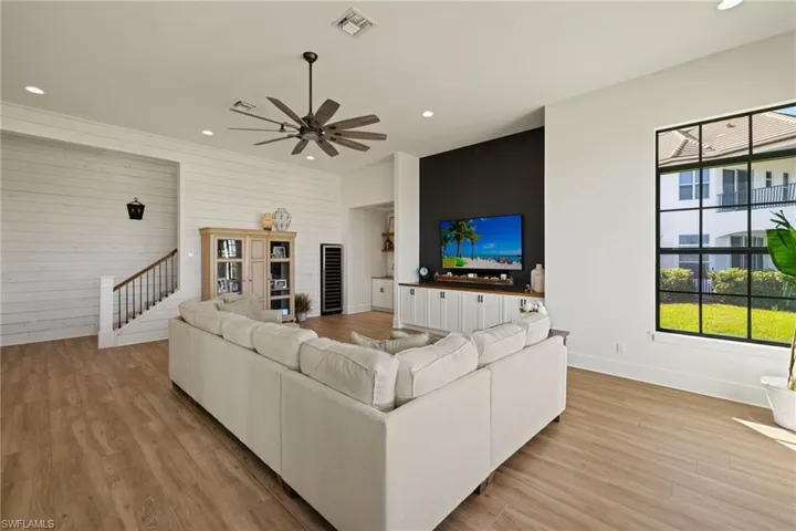 Living room featuring light hardwood / wood-style floors and ceiling fan