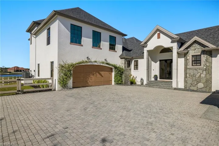 Courtyard front entrance with 2 car garage.