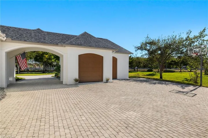 Bonus air-conditioned garage and separate golf cart garage.