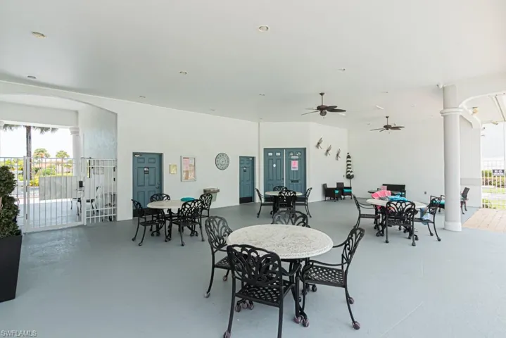 Dining space with healthy amount of natural light, arched walkways, and decorative columns