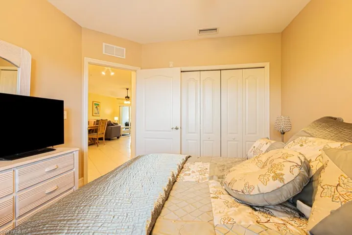 Bedroom featuring a closet and light tile patterned floors