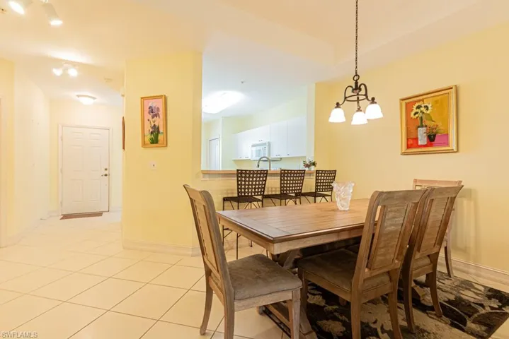 Dining space featuring a chandelier and light tile patterned floors