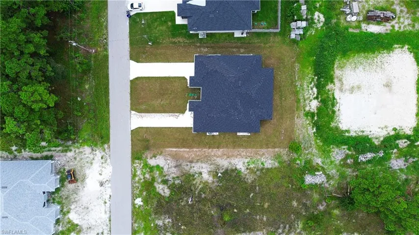 Aerial overview of property's location with nearby suburban area