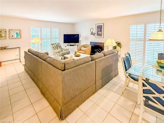 Rear view of house featuring stairway and a carport
