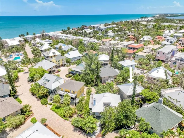 Aerial view of residential area with expansive Gulf Beach coastline
