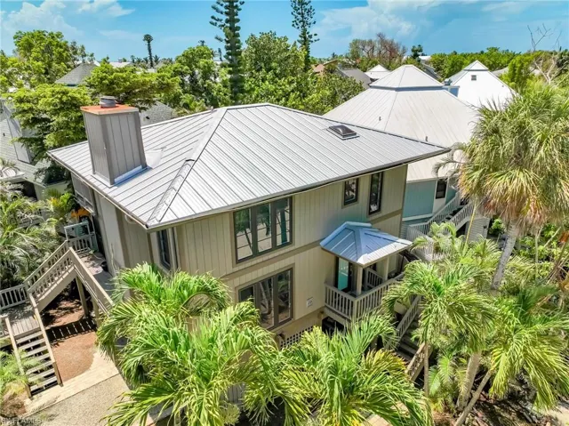 Rear view of property with stairs
