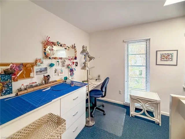 Unfurnished sunroom with a ceiling fan