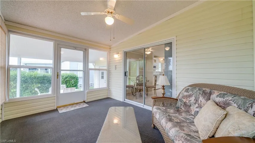 The sunroom is just steps from the breakfast area and the outdoor patio.