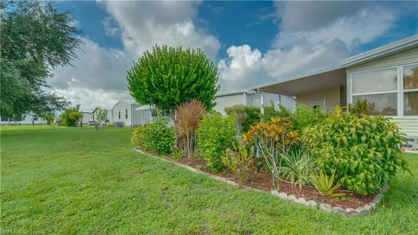 The back yard garden is full and thriving. The large open green space: one of a kind.