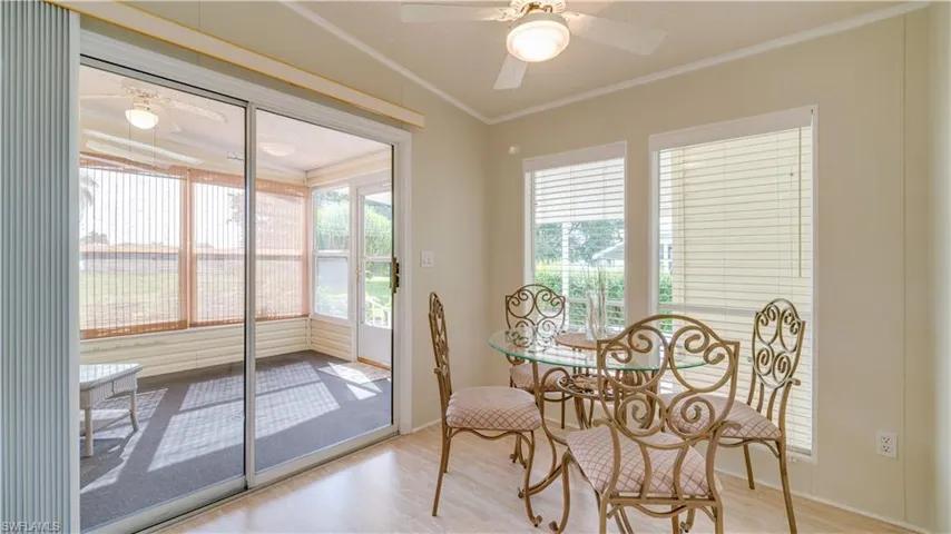 The light wood-type flooring, and the tall windows, add to the open feel of the home.