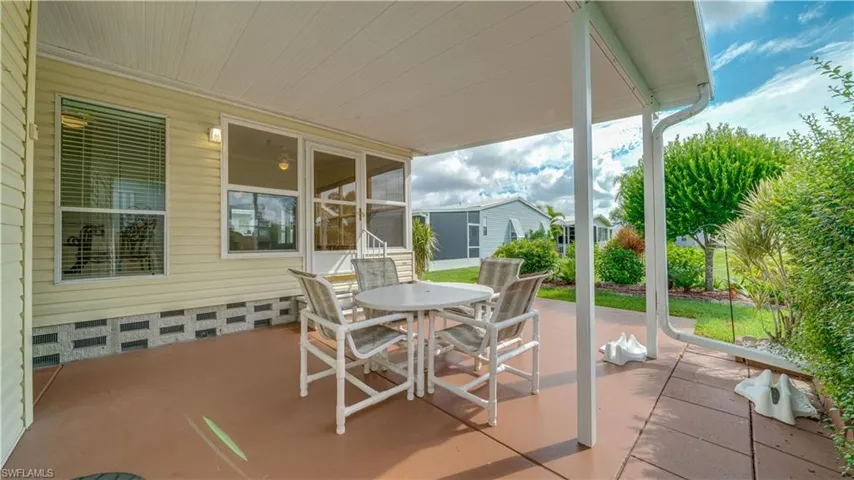 The extended, covered painted patio provides privacy with a view.