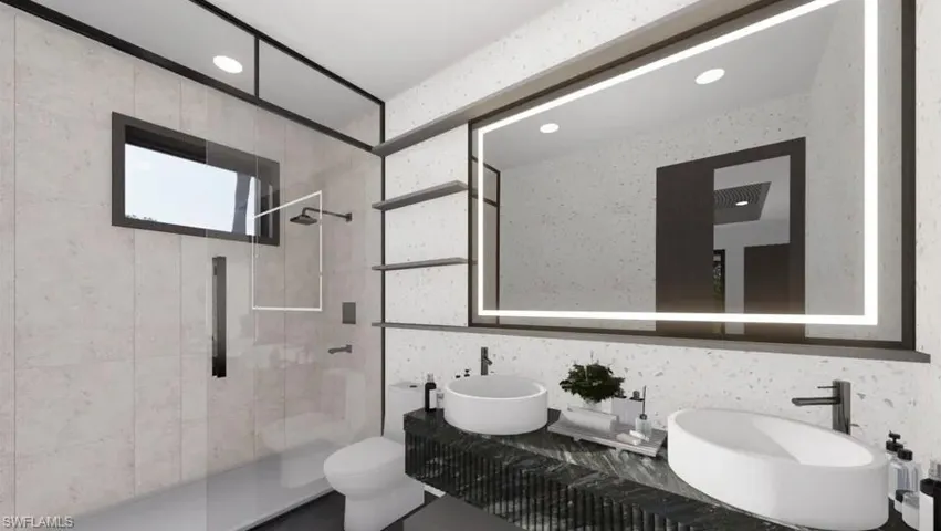 Contemporary bathroom featuring a dual vessel sink vanity with a dark textured countertop and an illuminated mirrored cabinet