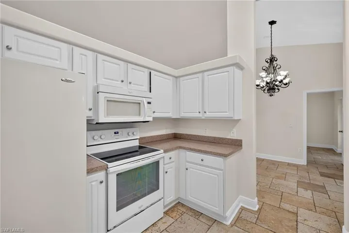 Kitchen with dining room beyond