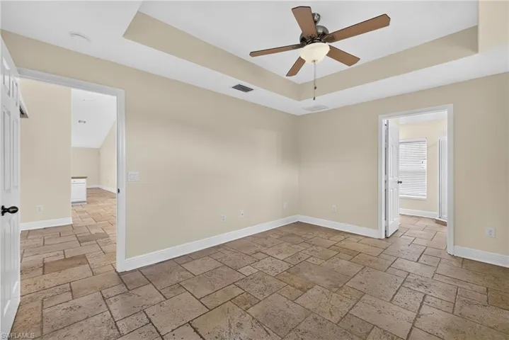 Master bedroom with master bath on right and dining room on left
