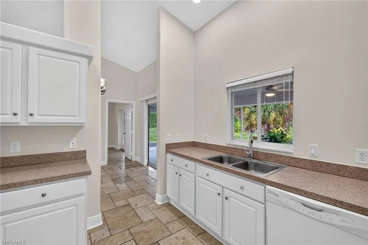 Kitchen with dining room beyond