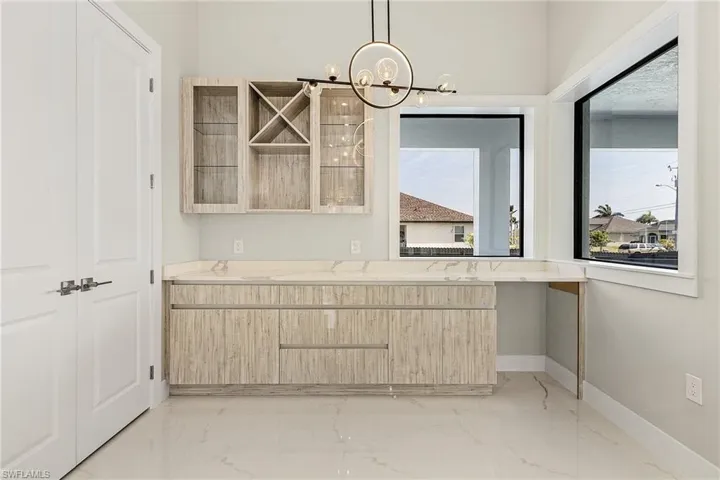 Doors to the left is pantry