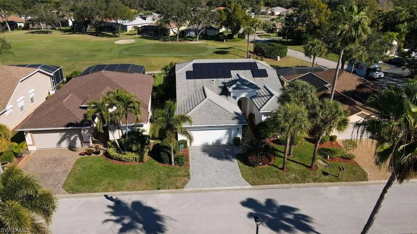 Aerial perspective of suburban area with a golf club