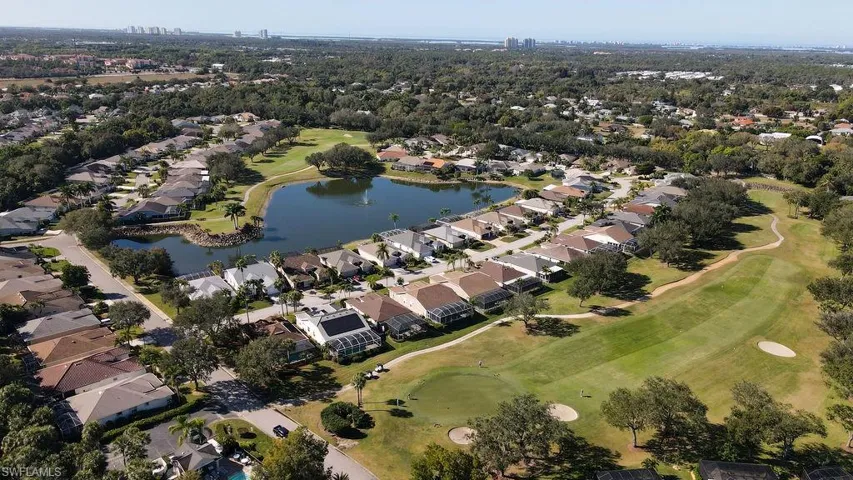 View of property location featuring a nearby body of water and nearby suburban area