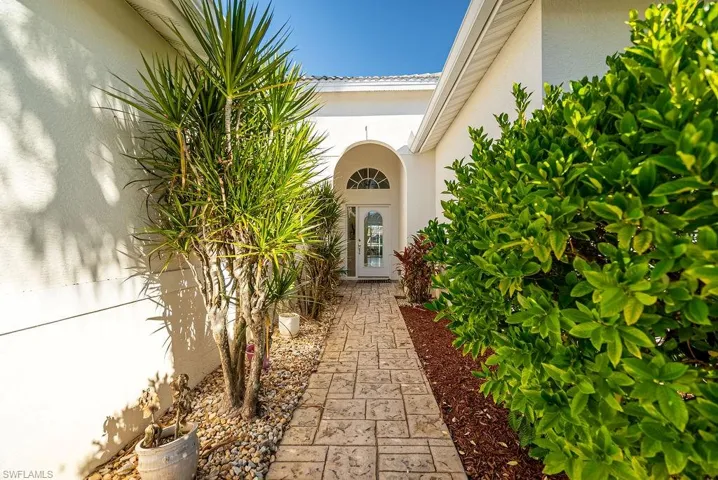 Property entrance featuring stucco siding