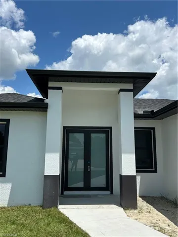 Back of house featuring french doors