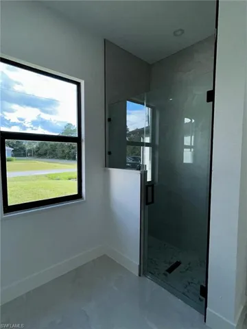 Bathroom with a shower with door