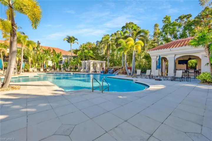 View of Community pool with a patio area