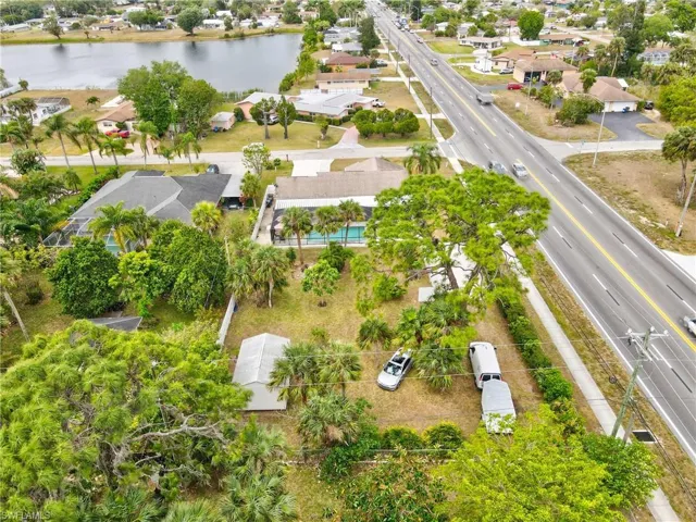 Aerial view of residential area featuring a large body of water