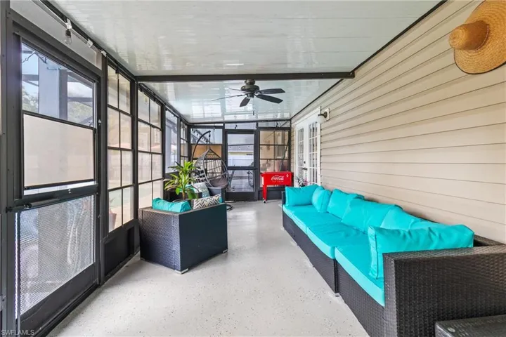 Sunroom with an outdoor hangout area, a ceiling fan, and french doors