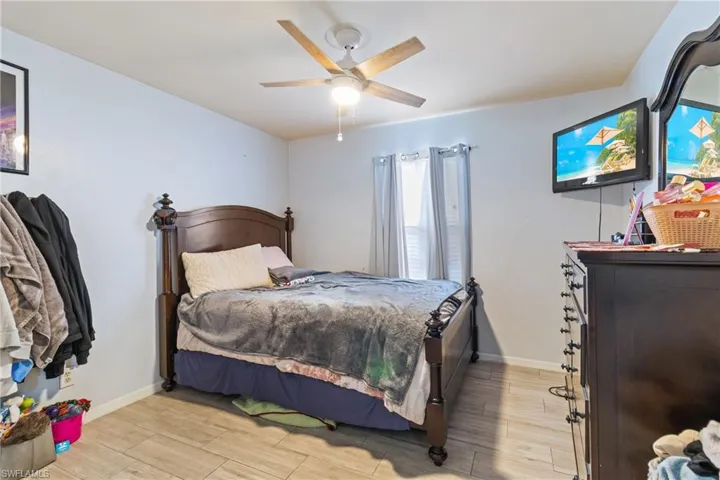 Bedroom featuring light wood-type flooring and a ceiling fan