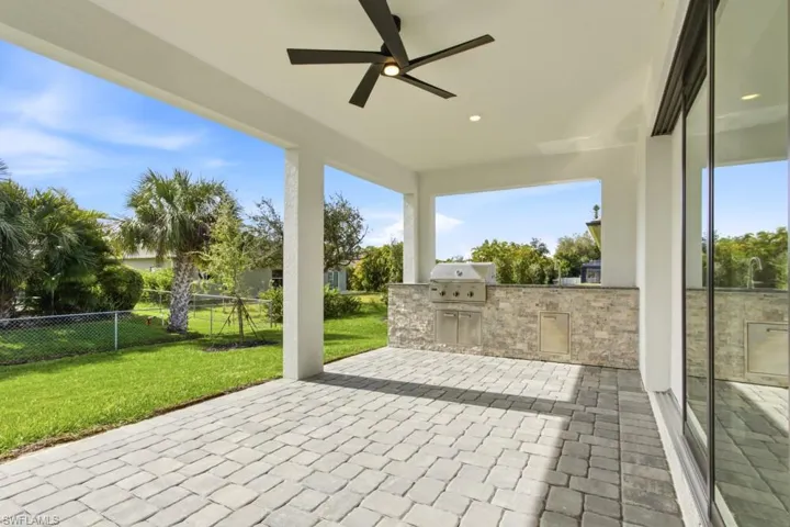 View of patio / terrace featuring exterior kitchen and ceiling fan