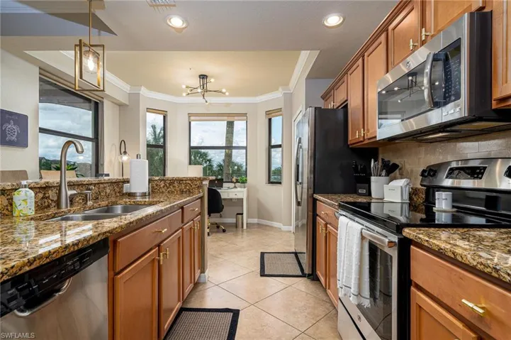 Kitchen with full appliance suite and lake view