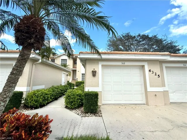 Front of the home with detached garage