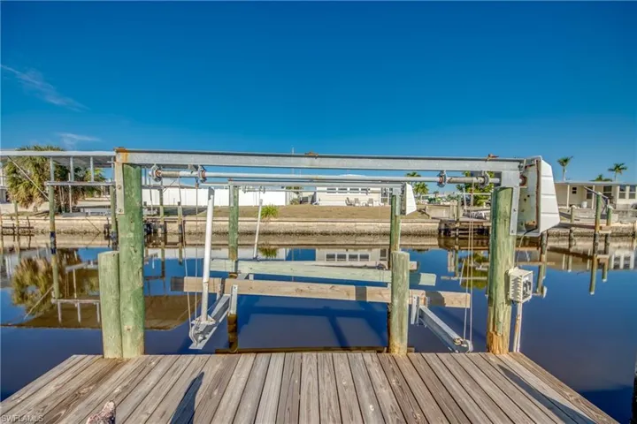 Dock area featuring boat lift and with Gulf access no bridges