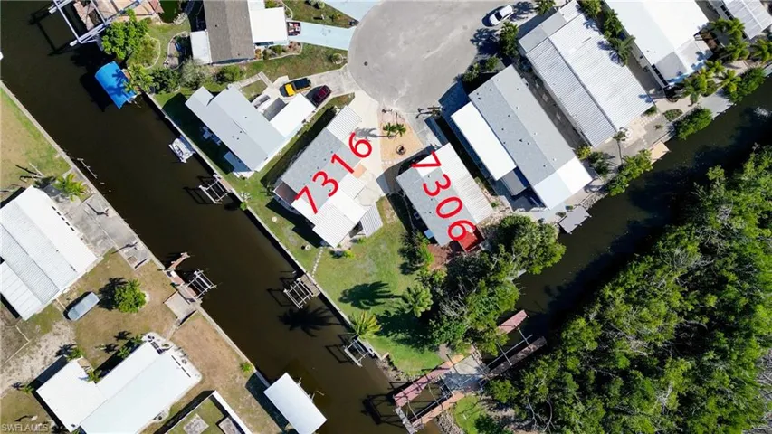 Aerial perspective of suburban area with a nearby body of water