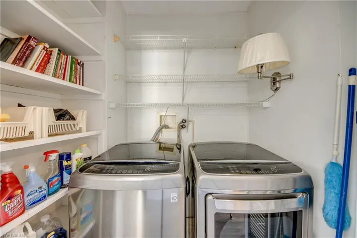 Washroom featuring washer and clothes dryer