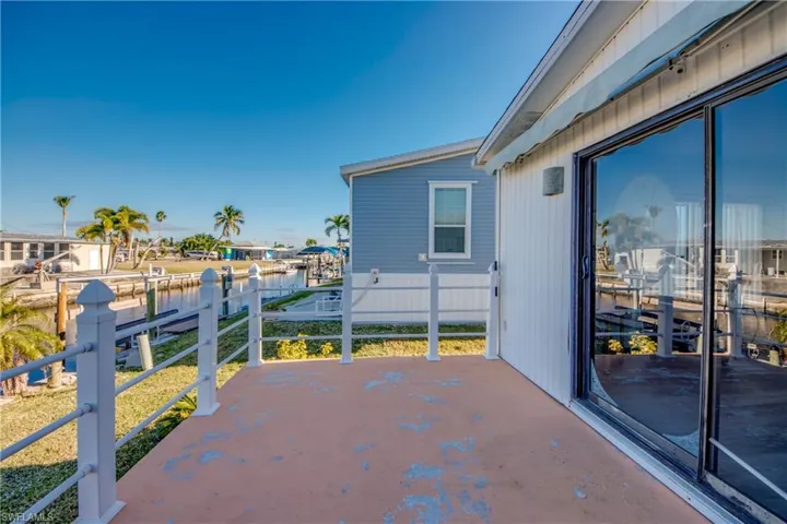 View of patio with a water view