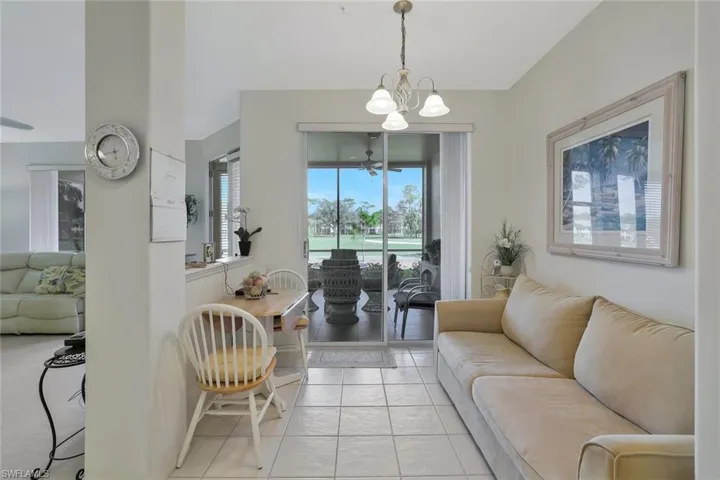 Living room featuring a chandelier and light tile patterned floors