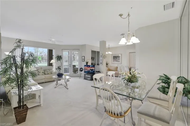 Dining room featuring a ceiling fan and hanging lights