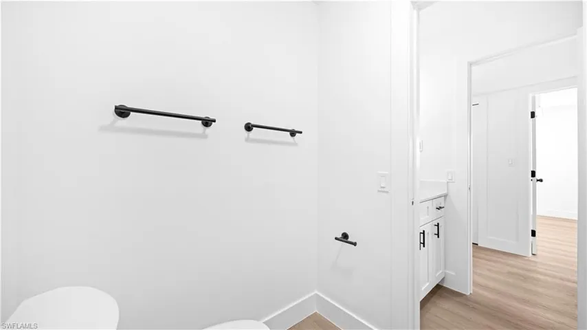 Bathroom featuring light wood-type flooring and vanity