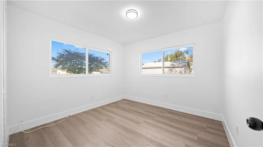 Spare room with light wood-style flooring