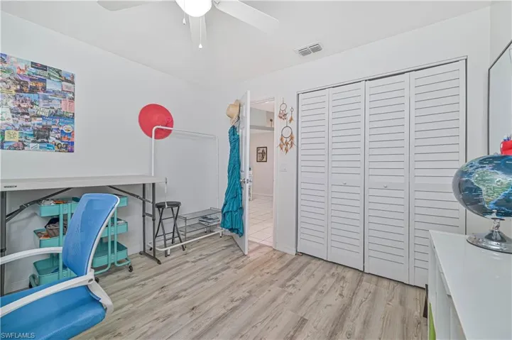 Office featuring light wood finished floors and ceiling fan