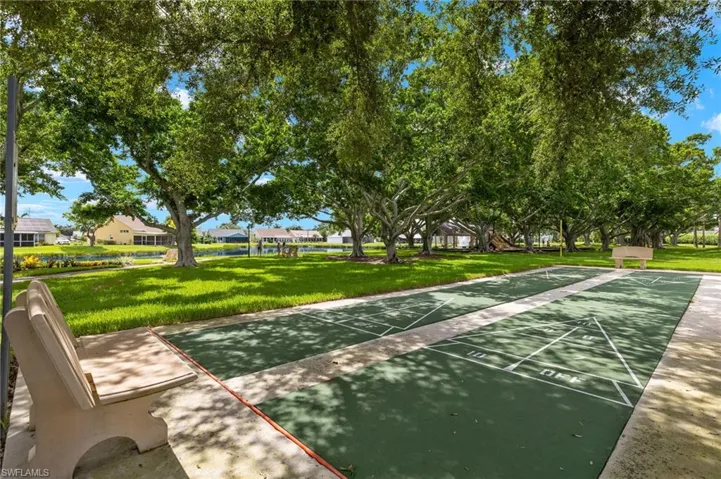 View of home's community featuring shuffleboard
