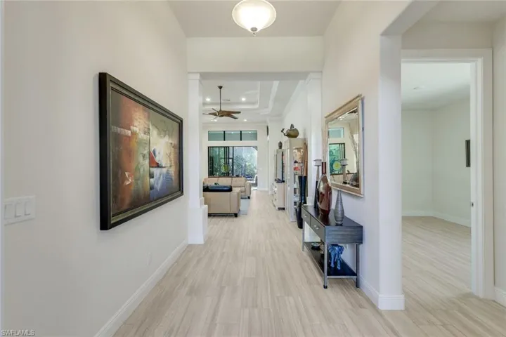 Hall featuring light wood-type flooring