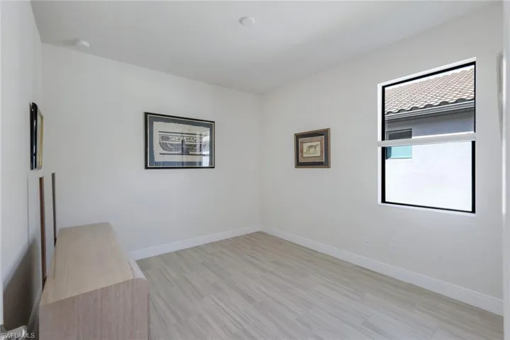 Unfurnished room with light hardwood / wood-style floors