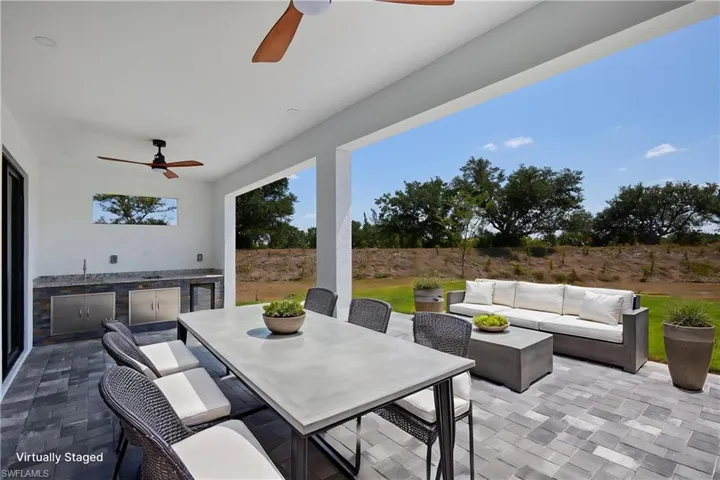 View of patio / terrace with area for grilling, a ceiling fan, a fenced backyard, outdoor lounge area, and outdoor dining space