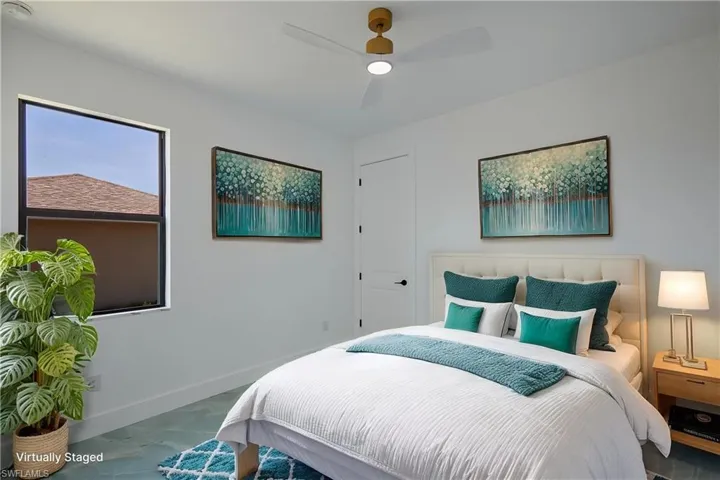 Bedroom with baseboards and ceiling fan