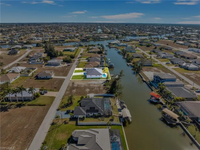 View of property location with nearby suburban area and a large body of water