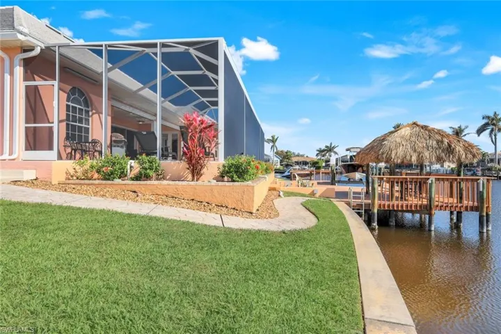 Path around house to dock and Tiki